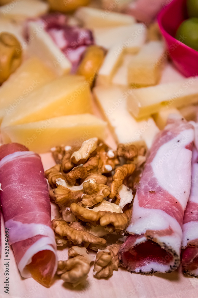 a delicious platter of Italian cold cuts and cheeses, accompanied by olives, honey and taralli