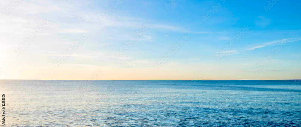 The view of the sea in the morning with the golden rays of the sun shining on the sea in summer The view of the sea in the morning with the golden rays of the sun shining on the sea in summer