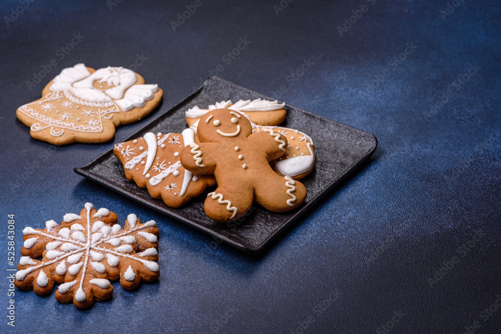 Christmas decorations and gingerbreads on a dark concrete table. Getting ready to celebration Christmas decorations and gingerbreads on a dark concrete table. Getting ready to celebration