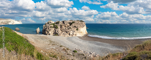 Panorama of Cyprus. Aphrodites bay on summer day. Panorama of Petra-Tu-Romiou. Seascape of island of Cyprus. Mediterranean resorts. Rock of Aphrodite near city of Paphos. Cyprus landscape photo