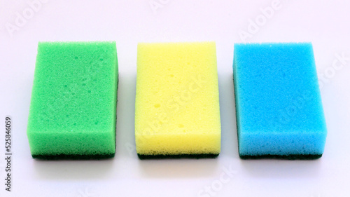 multi-colored foam rubber sponges for washing dishes close-up on a white background