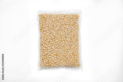 Peeled Pine Nut In Transparent Vacuum Big Plastic Packaging On White Background.