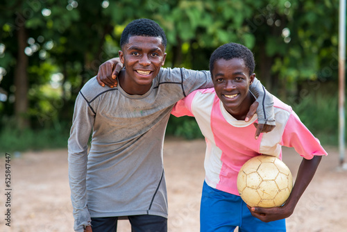 Wallpaper Mural Two happy African soccer players holding football and looking at camera Torontodigital.ca