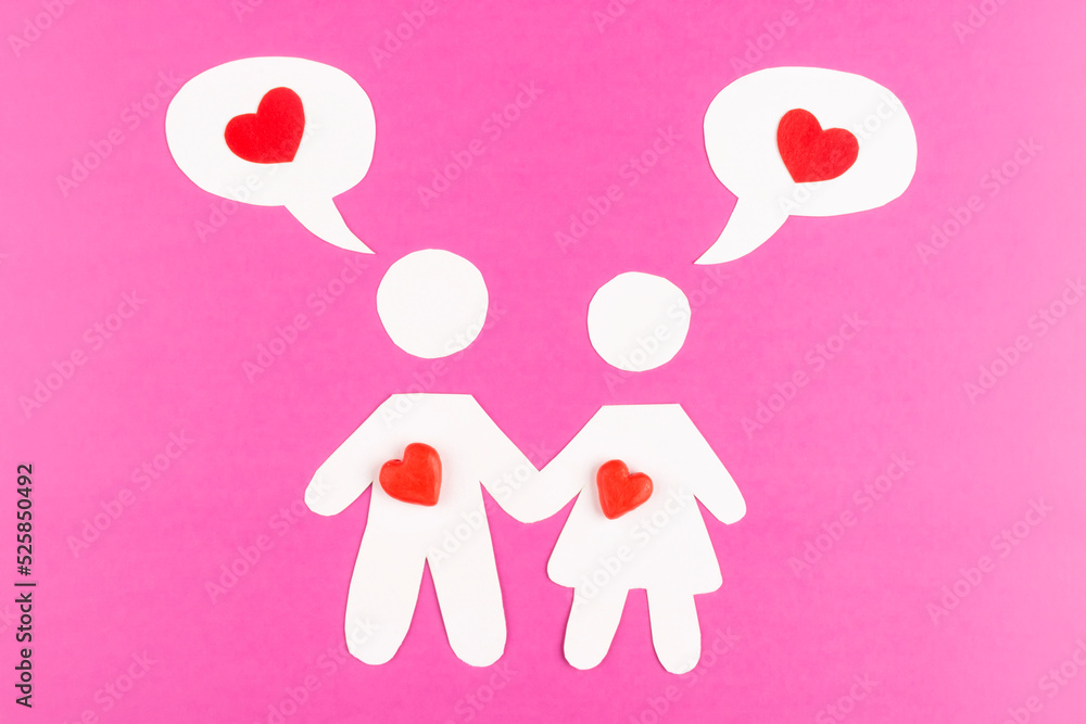 Silhouettes of men and women loving each other. A girl and a guy with a speech balloon with a heart inside on a pink background. The concept of love, relationships, family creation, happiness. Lovers Silhouettes of men and women loving each other. A girl and a guy with a speech balloon with a heart inside on a pink background. The concept of love, relationships, family creation, happiness. Lovers