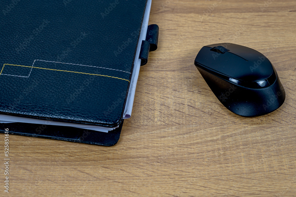 Notebbok and mouse on a wooden table, Busniess and tecnology concept. Notebbok and mouse on a wooden table, Busniess and tecnology concept.