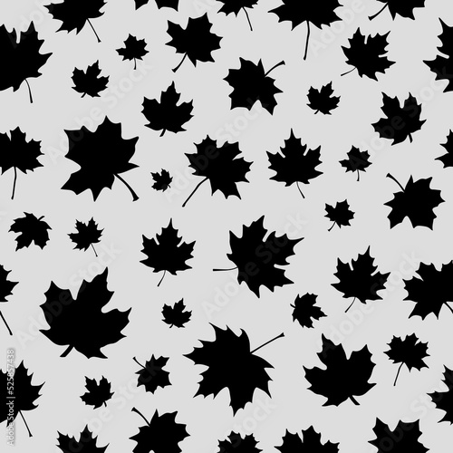 Halloween seamless pattern made up of many black maple leaves on the white background for printing on wrapper  package  cloth  textile or cards. Endless repeating texture for autumn holidays.