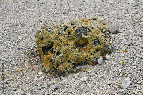 volcanic bomb among the tephra on the slope of the volcano close-up photo