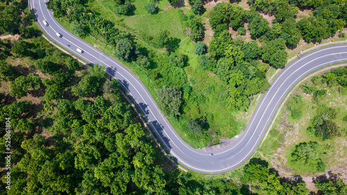 Aerial view of road going through greenery, Roads through the green forest, drone landscape photo