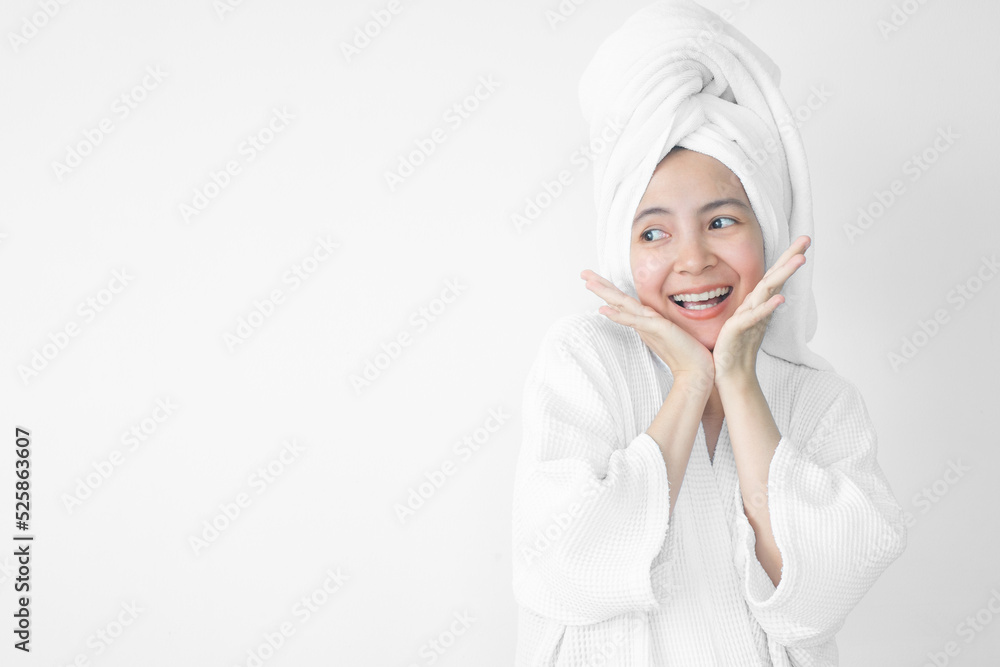 Beautiful Asian woman wearing bathrobe on white background, Face care, Skin care, Facial treatment, Cosmetology, beauty and spa Concept. Beautiful Asian woman wearing bathrobe on white background, Face care, Skin care, Facial treatment, Cosmetology, beauty and spa Concept.