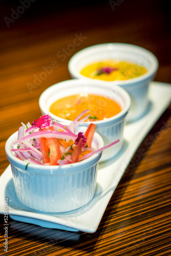 White little bowls with traditional peruvian sauces