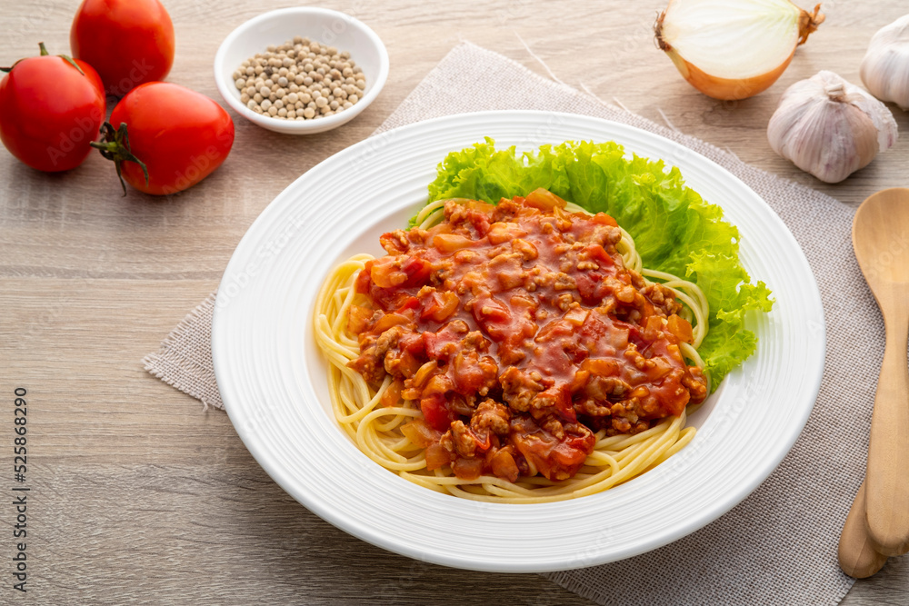 Spaghetti with minced Pork and Tomato Sauce on white plate Spaghetti with minced Pork and Tomato Sauce on white plate