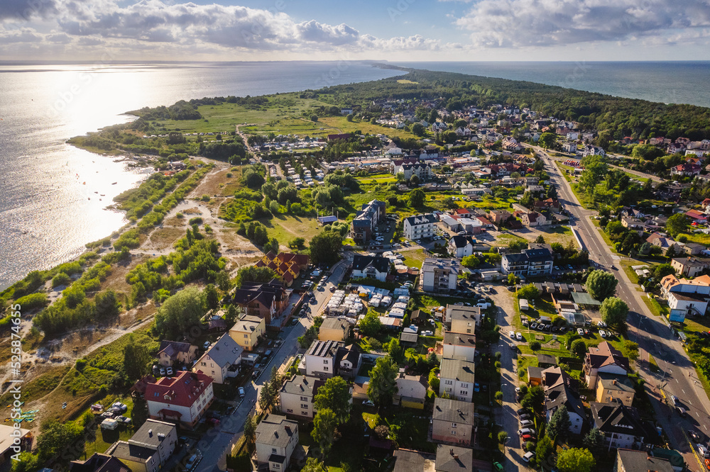 Summer view from the air of the Hel Peninsula, a calm and nice landscape over Jastarnia village.