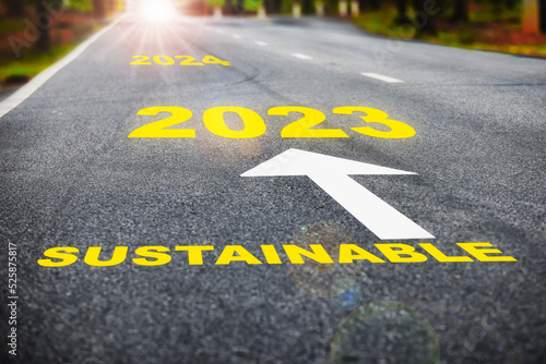 2023 to 2024 sustainable on asphalt road surface with marking lines. Sustainable future concept and Inspiration with motivation idea © smshoot
