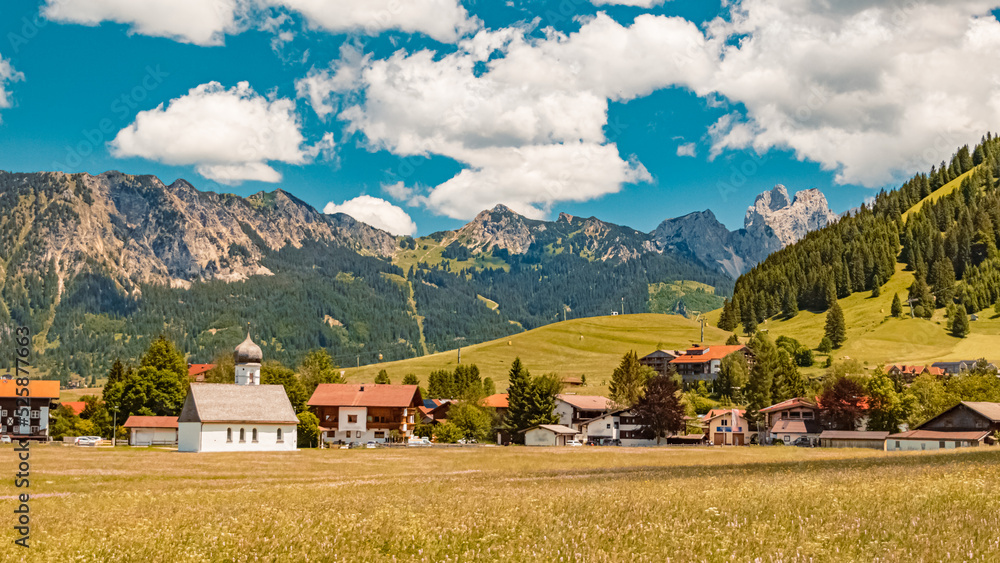 Beautiful alpine summer view with a curch at the famous Tannheimer Tal valley, Tannheim, Tyrol, Austria Beautiful alpine summer view with a curch at the famous Tannheimer Tal valley, Tannheim, Tyrol, Austria