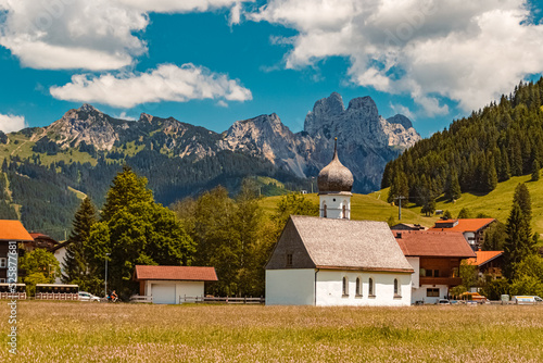 Beautiful church on a sunny summer day at the famous Tannheimer Tal valley, Tannheim, Tyrol, Austria