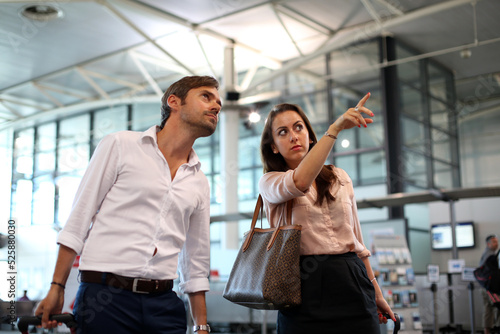 couple waiting their fly at the airport