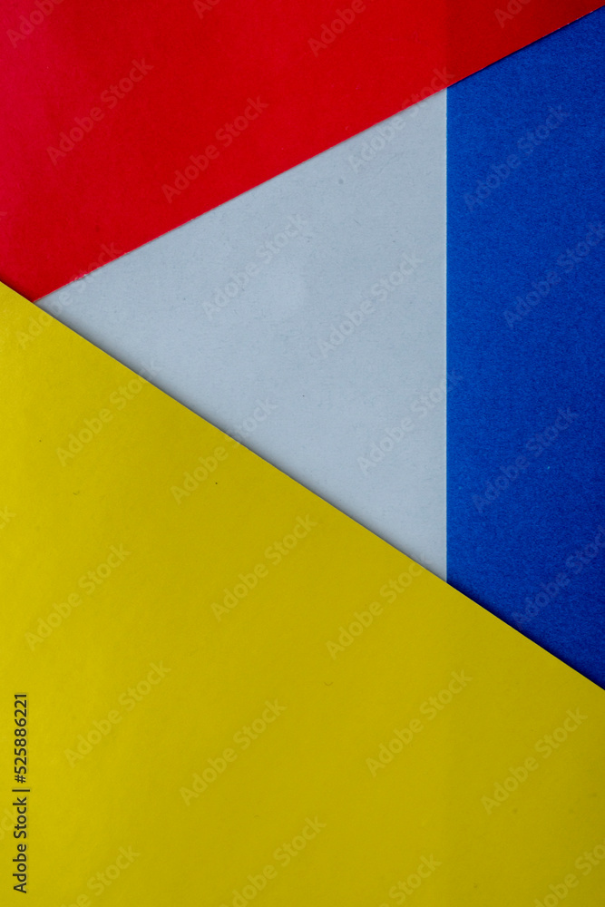 Abstract paper is a colorful background, a creative design for pastel wallpaper. Yellow, white, red and blue colors. Clash of Russia and Ukraine, war. The symbol of intertwining and overlapping. Abstract paper is a colorful background, a creative design for pastel wallpaper. Yellow, white, red and blue colors. Clash of Russia and Ukraine, war. The symbol of intertwining and overlapping.