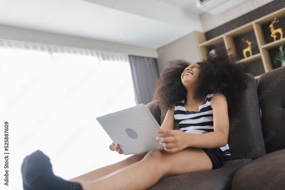 Excited cheerful young Black woman using laptop computer on sofa at home, feeling joy, singing, laughing, happy time, Cute little Girl Study At Home With Laptop And Headphones, Relax concept Excited cheerful young Black woman using laptop computer on sofa at home, feeling joy, singing, laughing, happy time, Cute little Girl Study At Home With Laptop And Headphones, Relax concept