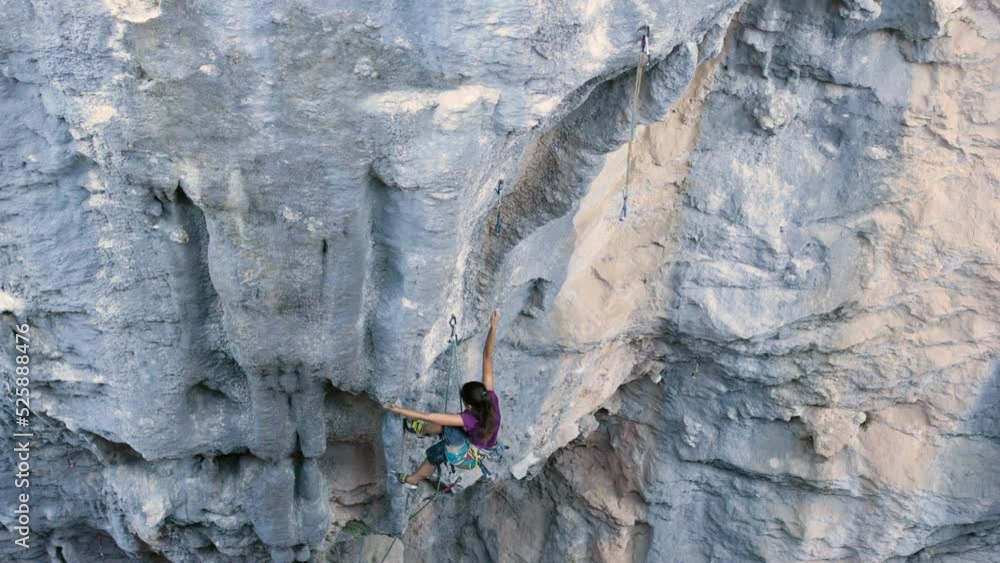 girl climbs the climbing path. rest at nature. climber climbs to the top of the mountain. girl goes in for sports in nature. girl climbs the climbing path. rest at nature. climber climbs to the top of the mountain. girl goes in for sports in nature.