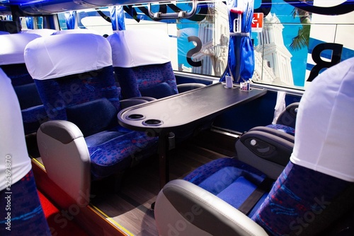 Bus seats with table for games and fun.