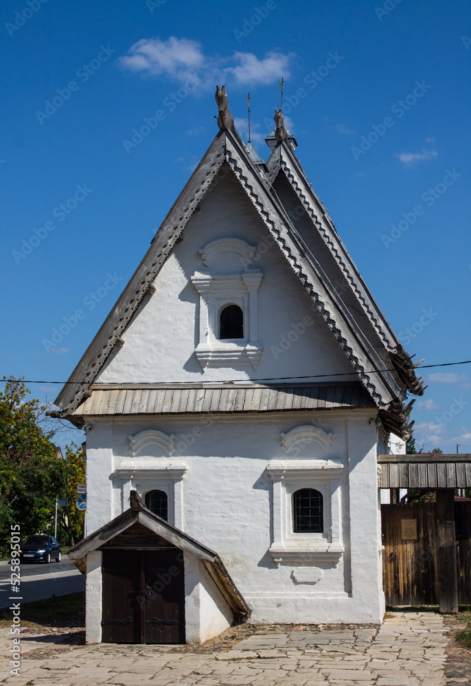Suzdal, Vladimir Region, Russia - August, 18, 2022: an old white-stone manor house in the old town on a sunny summer day