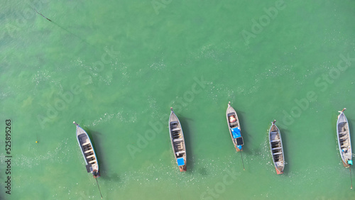 Many fishing boats near the seashore in tropical islands. Pier of the villagers on the southern island of Thailand. top view from drones. © scentrio