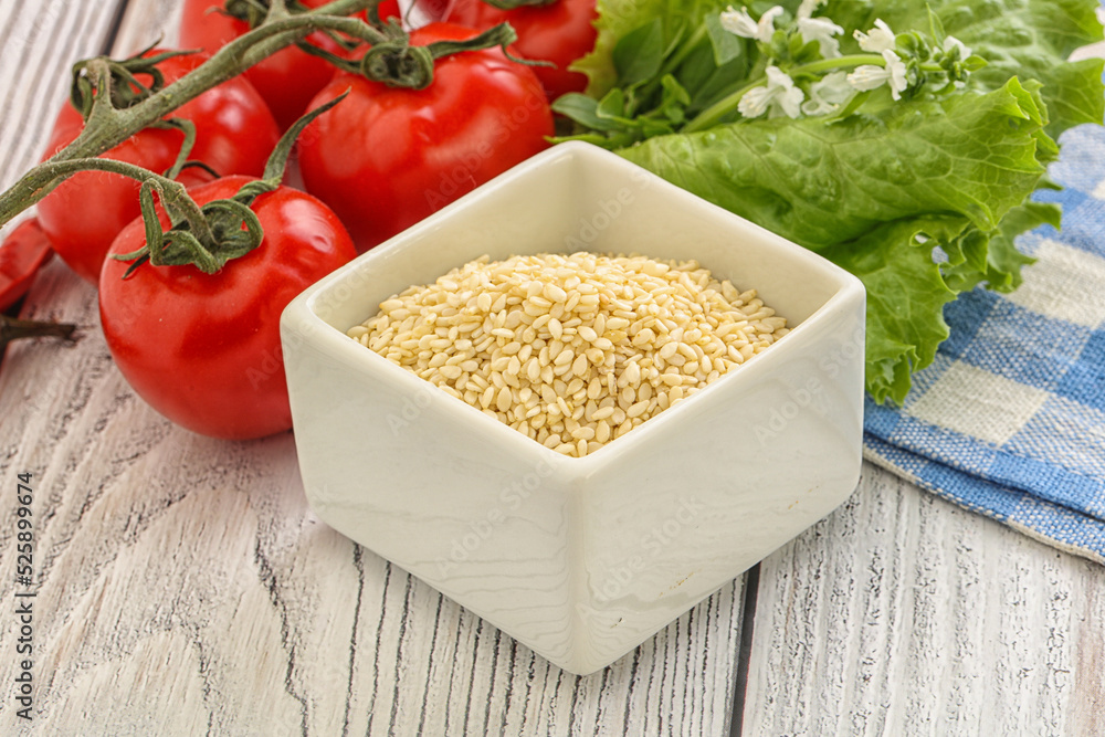 Raw sesame seeds in the bowl Raw sesame seeds in the bowl
