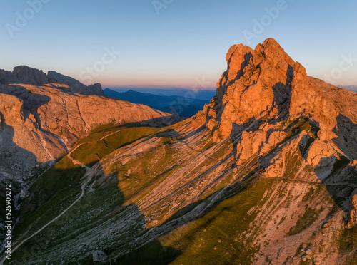 Summer sunset in the mountains of the Dolomites in Italy.  photo