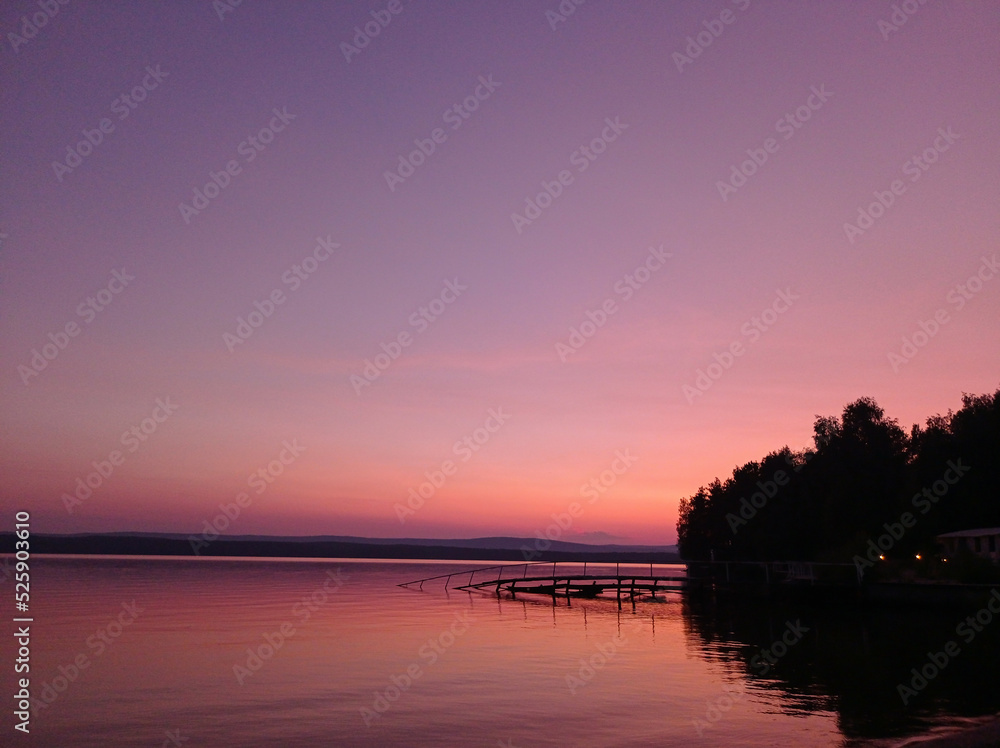 Beautiful pink sunset on the lake. Nature Backgrounds
