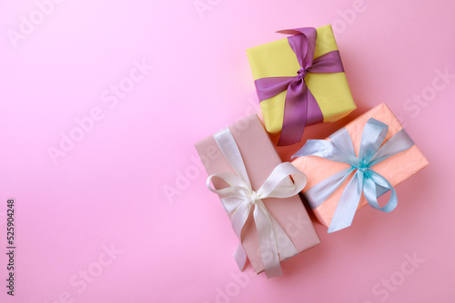 Fototapeta Naklejka Na Ścianę i Meble -   Gift boxes  on color background. Happy womens day. Happy Mothers day.Hello Spring- Image