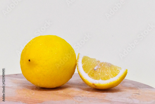 lemon on a wooden cutting board