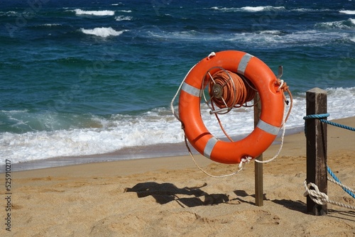 Lifebuoy on the beach with sea