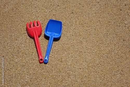 shovel and rake on the sand