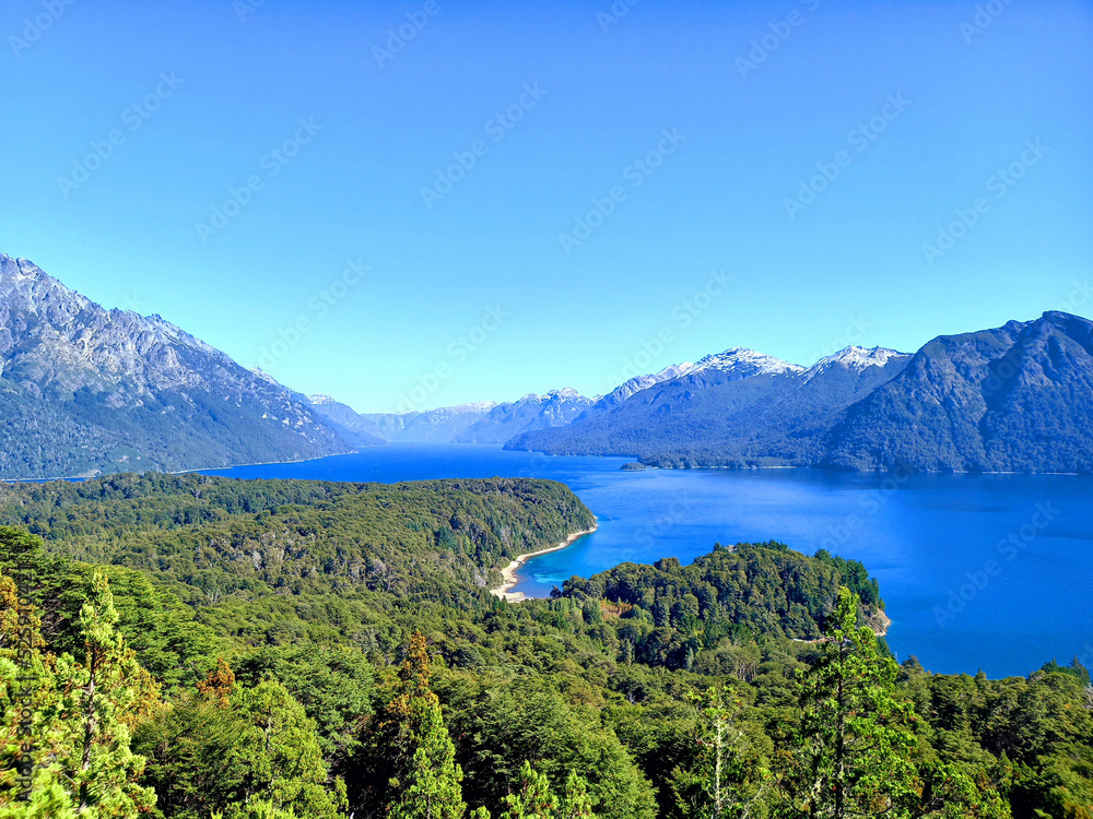 Patagonia lake landscape with Andes mountain range under blue sky. Nature and National Parks.