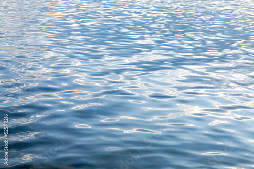 Abstract background, water surface with ripples. The texture of the water.