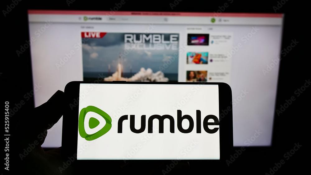 Device Label Rumble Stuttgart, Germany - 12-19-2021: Person holding smartphone with logo of ...