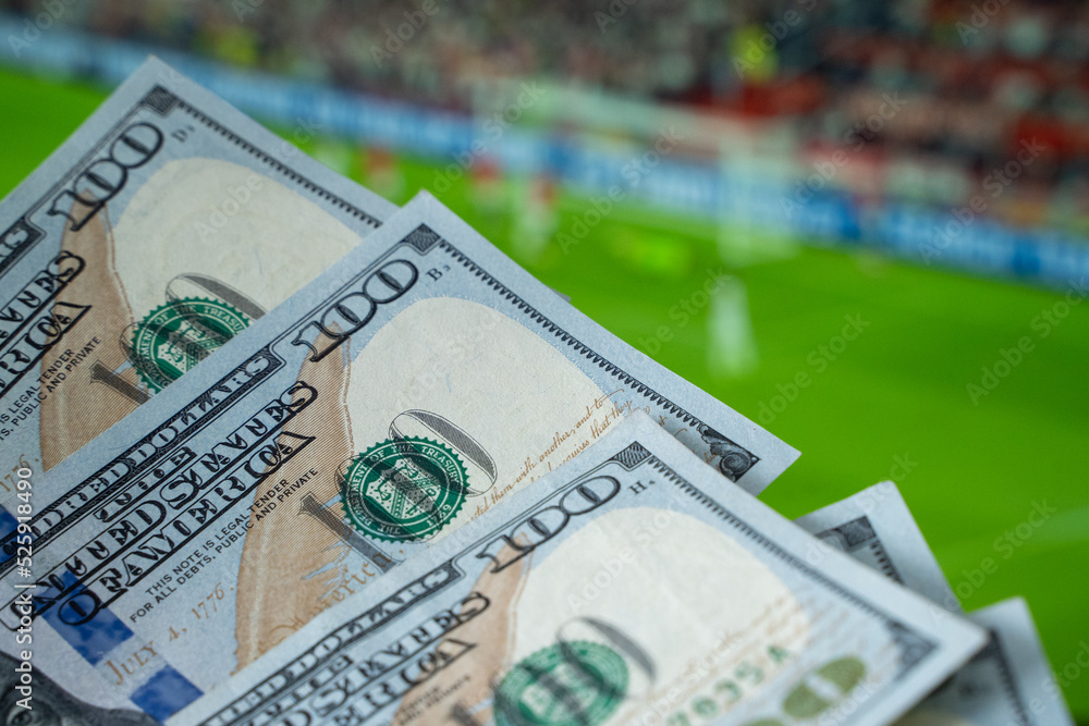 American Dollars and Football Betting on the Background American Dollars and Football Betting on the Background