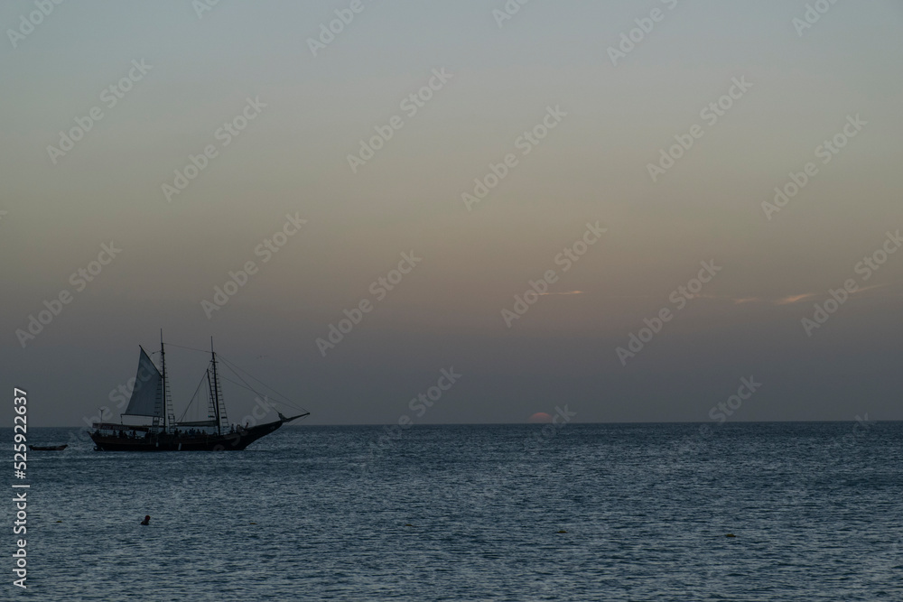 sailboat at sunset aruba