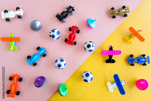 Toys in pink and yellow background, happy children's day