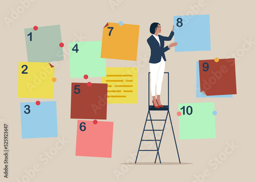 Arrange to do list which job to do before and after, set work priority,  task management concept. Businesswoman manage to prioritize sticky note with number. photo
