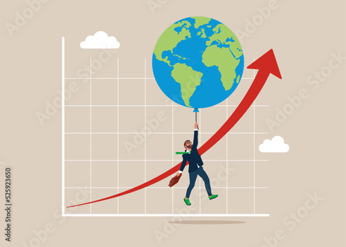 Balloon with the symbol of the world map floats higher. High global inflation. FED interest rate hike. floating interest. Global economic crisis. Inflation high up. 