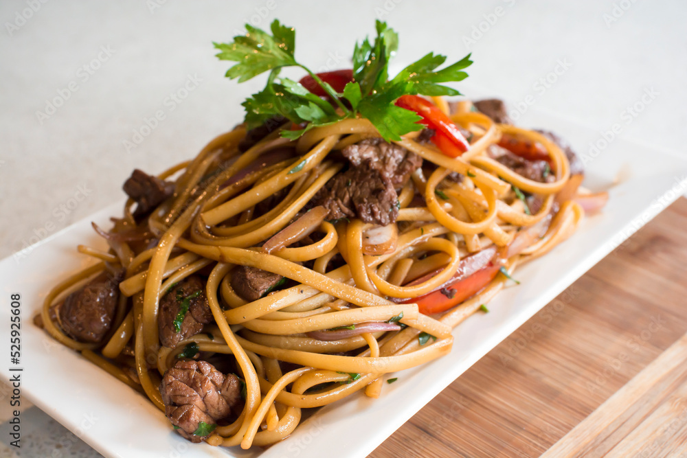 Tallarines con lomo saltado noodles with sauted meat peruvian gourmet restaurant food Tallarines con lomo saltado noodles with sauted meat peruvian gourmet restaurant food