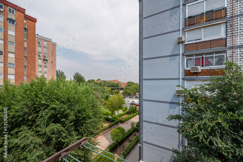 Views of urban residential buildings with lots of trees between block courtyards