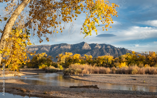 Autumn Along the River with Mountain Background photo