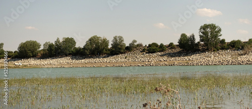 The irrigation dam of a village has lost a lot of water as a result of drought, the pond whose water has decreased, the tragic situation of the drought and irrigation pond,