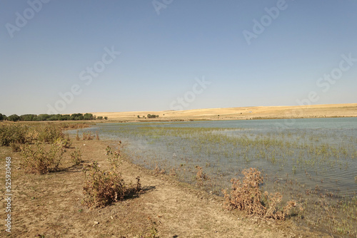 The irrigation dam of a village has lost a lot of water as a result of drought, the pond whose water has decreased, the tragic situation of the drought and irrigation pond,