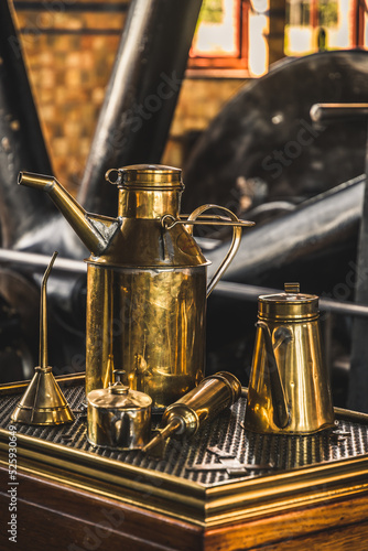 Obraz na plátně Old brass oil cans for lubricating machines