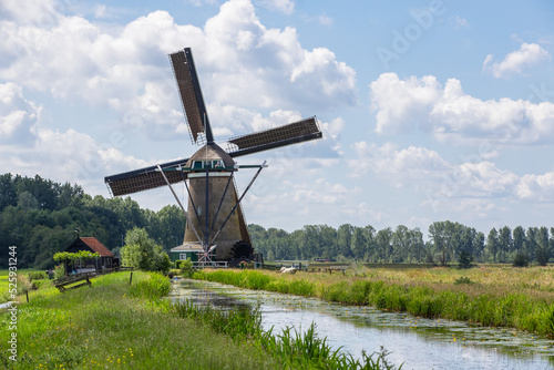 Mill along a narrow river near the Dutch village of Oud-Alblas.