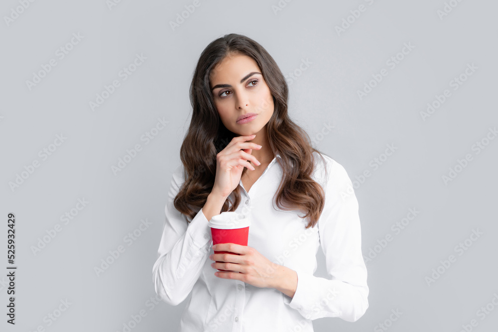 Business woman coffee hild cup coffee over gray background. Business woman coffee hild cup coffee over gray background.