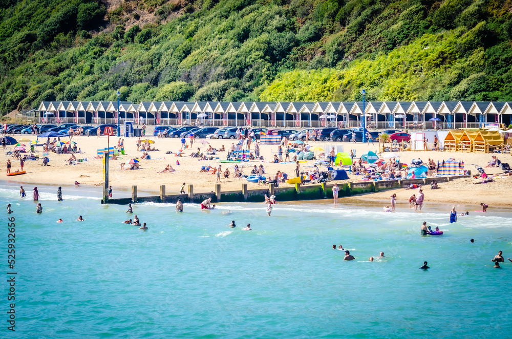 August 24, 2022, Boscombe Beach, Bournemouth, United Kingdom - People on the beach in a very hot summer day, England